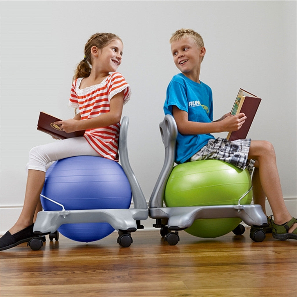 Medicine Ball Sitting On An Exercise Ball Benefits Using A Medicine